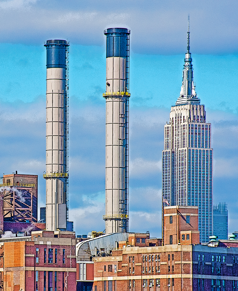 2 smokestacks and a skyscraper from the East River Manhattan New York City on 25 january 2017